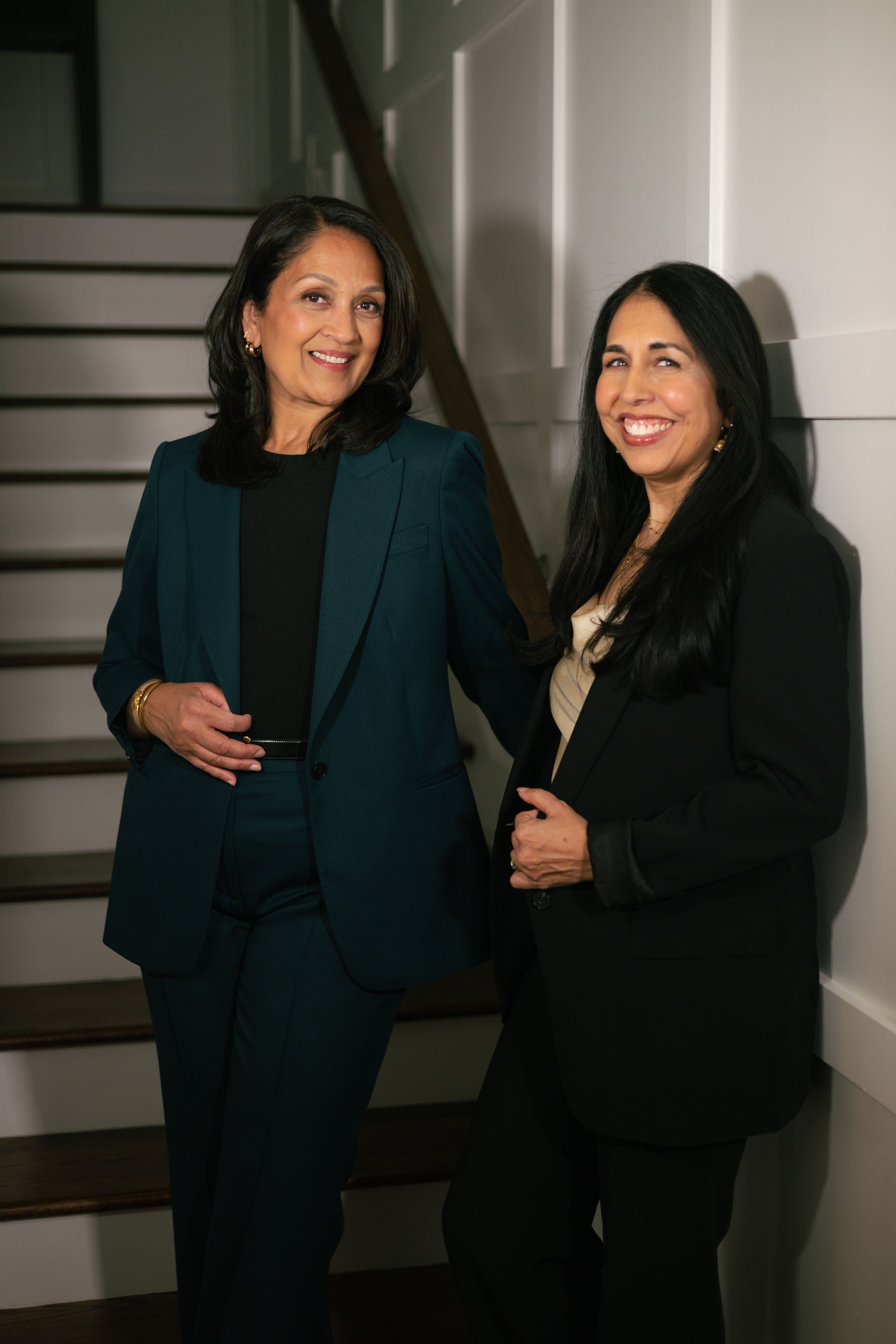 Arvasi founders standing together on a staircase